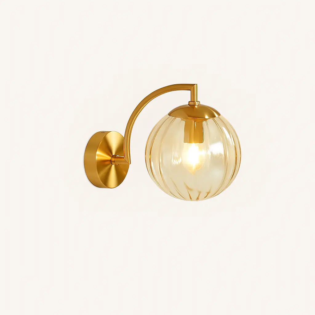 Elegant retro brass wall light with ribbed glass globe creates a warm, inviting glow.