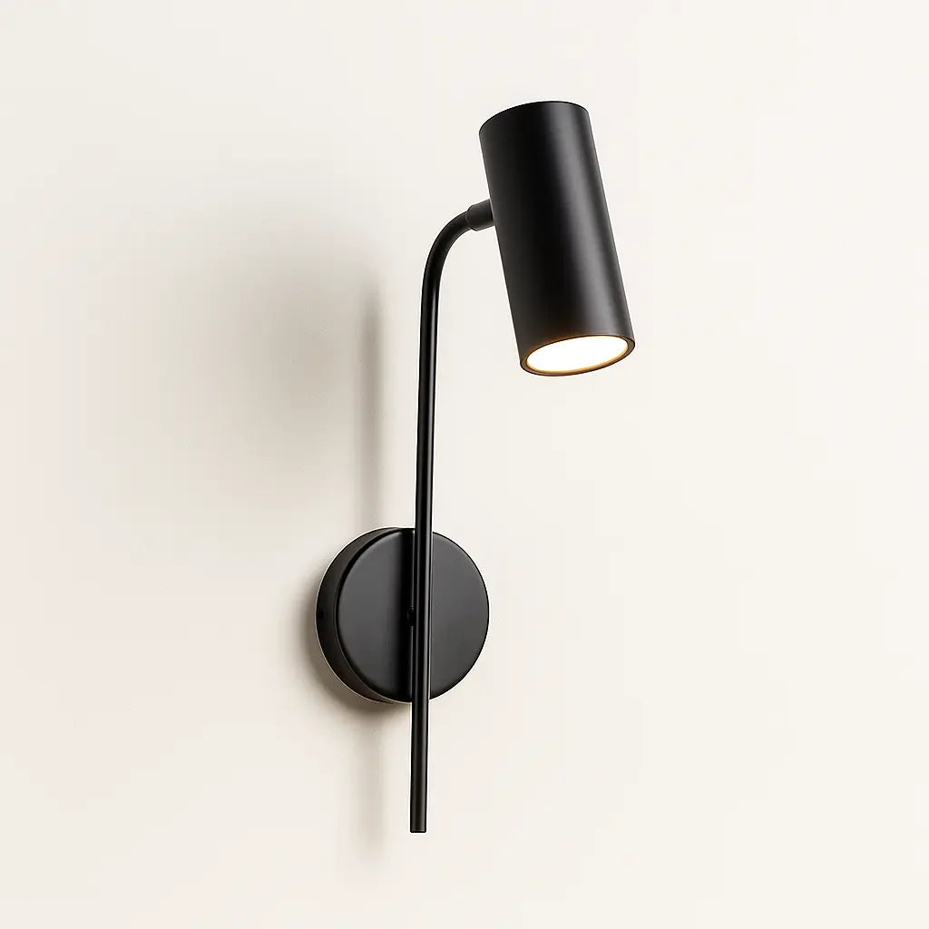 Bright, adjustable LED sconce in gold offers focused, modern lighting for your bedside or office.