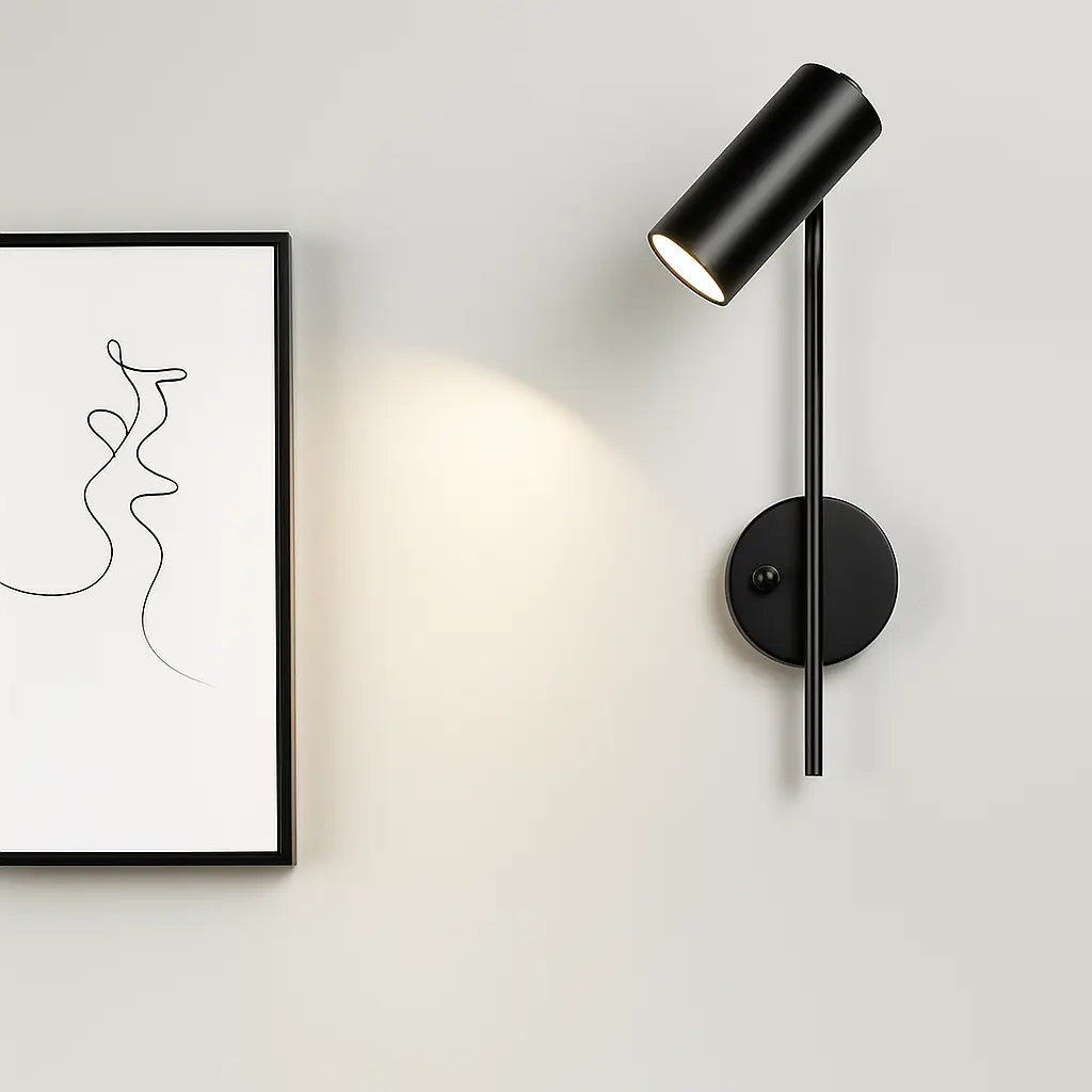 Warm LED sconce casts soft, focused light—perfect for accenting art or creating mood.