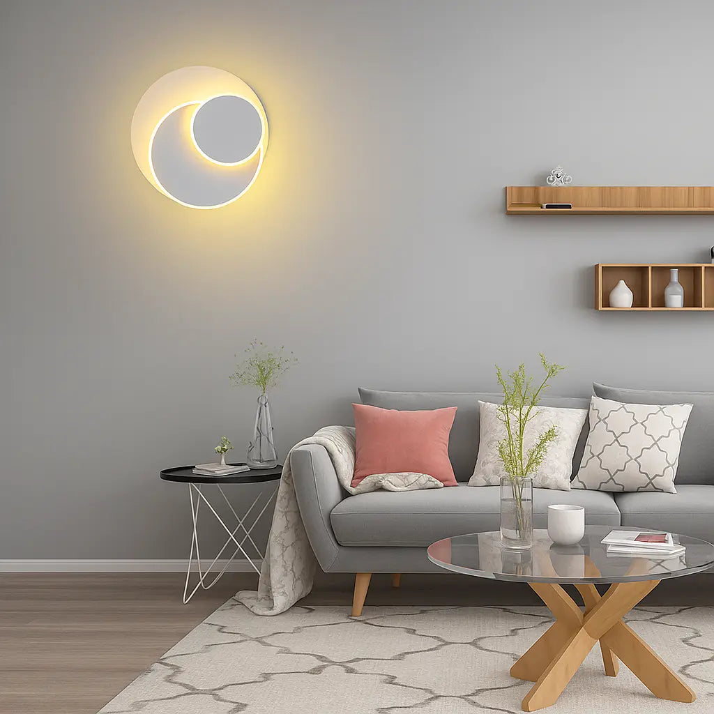 A modern LED wall sconce emits a soft yellow glow, creating warm, ambient lighting.