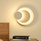 The ORLUNE HOME sconce casts a modern, adjustable LED glow perfect for nighttime reading.