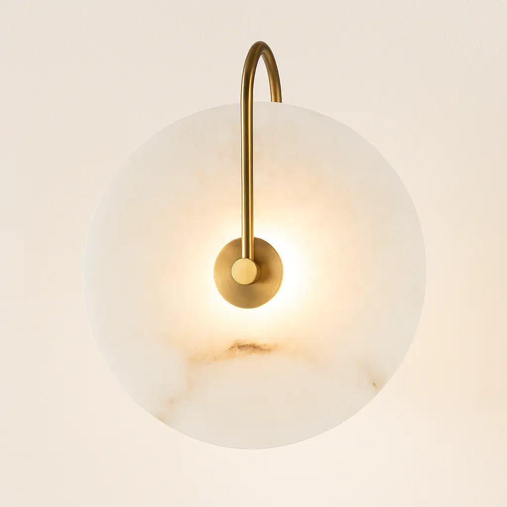 Warm LED light glows softly, creating cozy ambiance with stylish gold and white fixture.