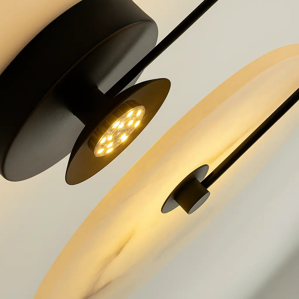 Warm LED glow from circular lamp highlights elegance and enhances ambiance with golden accents.