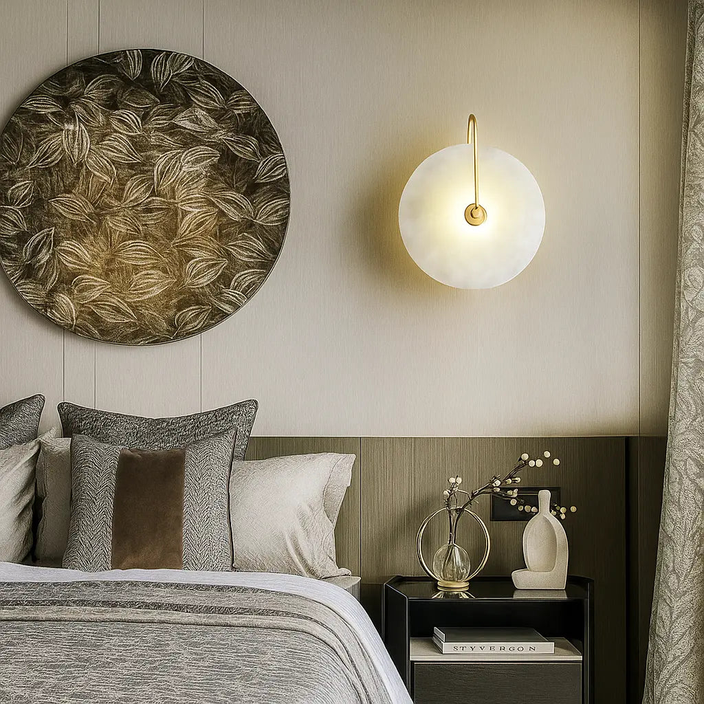 The ORLUNE HOME Circular Gold Marble LED Wall Lamp casts a soft, elegant glow.