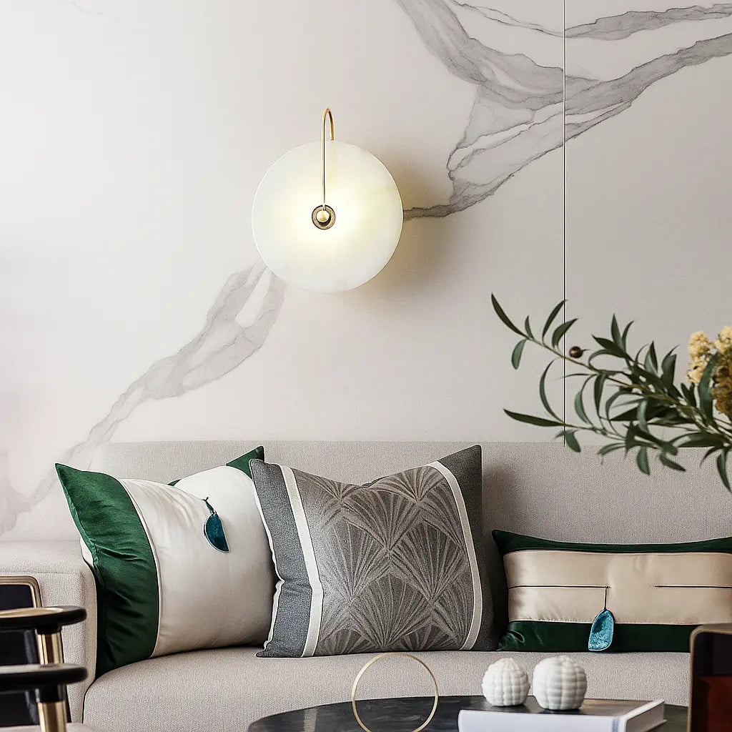 Circular Gold Marble LED Wall Lamp by ORLUNE HOME casts a warm, elegant glow.