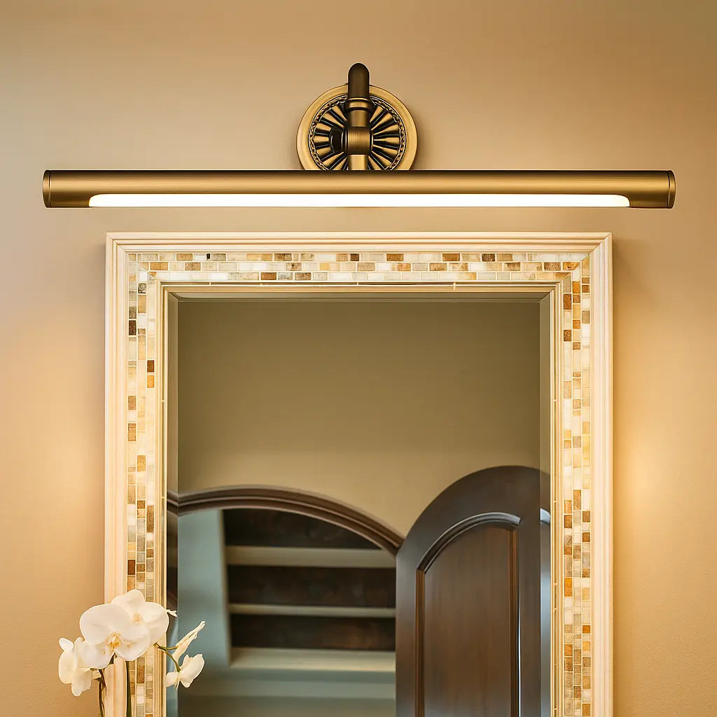The ORLUNE HOME Retro Brass Gold Wall LED casts a warm, elegant glow on the mirror.