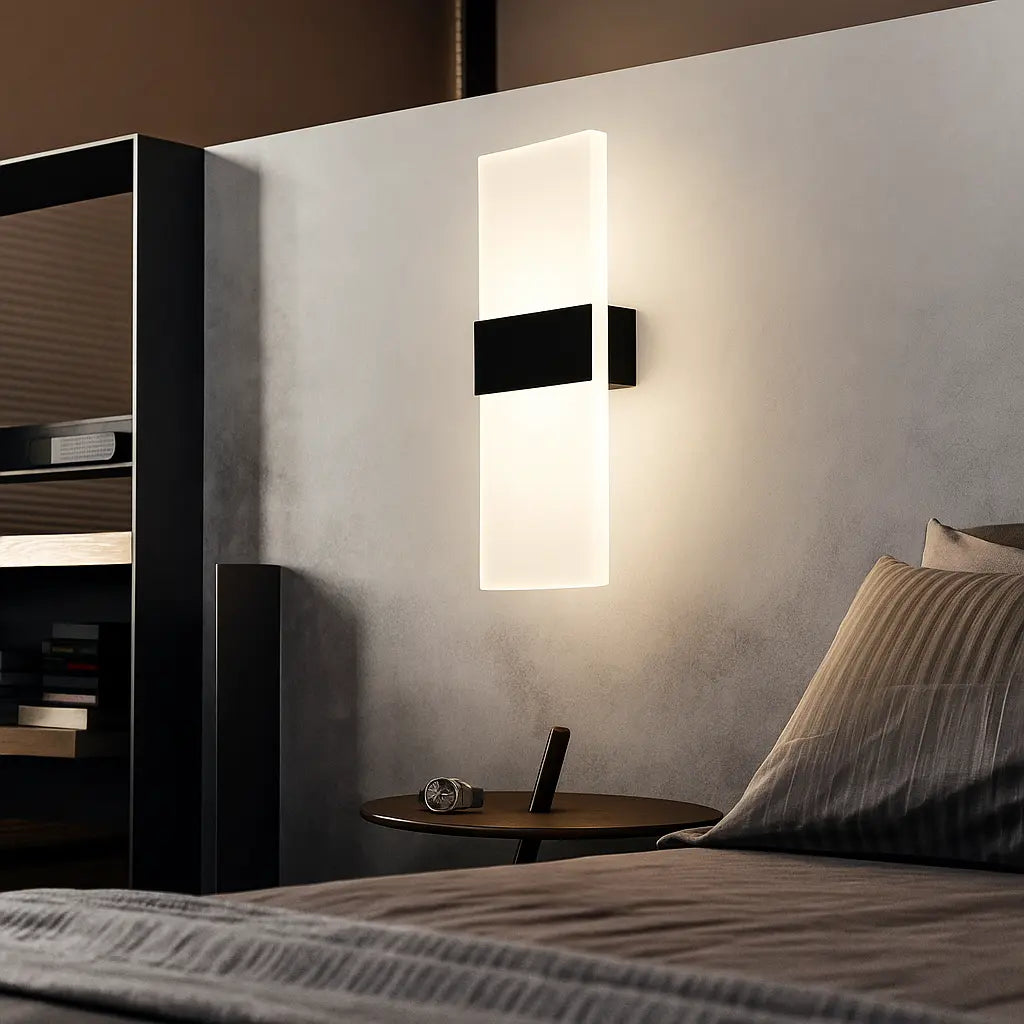 Soft gold LED wall sconce emits a warm, soothing glow in the modern bedroom.