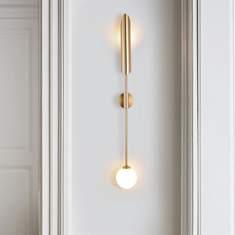 Golden LED wall light delivers modern, layered illumination with glowing orbs and elegant ambient glow.