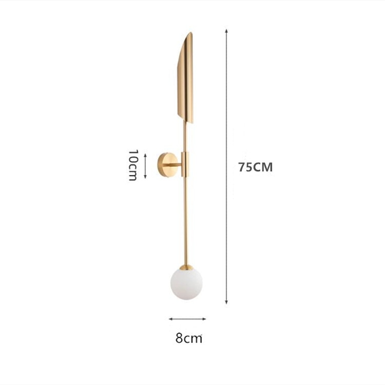 Warm ambient glow from integrated LED in a vertical gold-accented wall fixture.