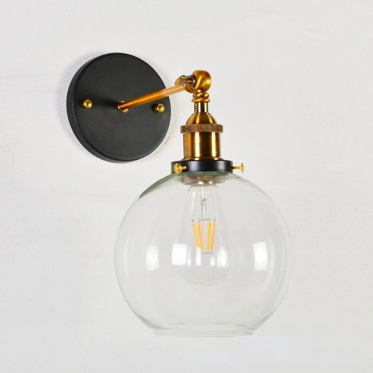 Elegant lighting: clear glass shade, vintage LED bulb, black and gold accents.
