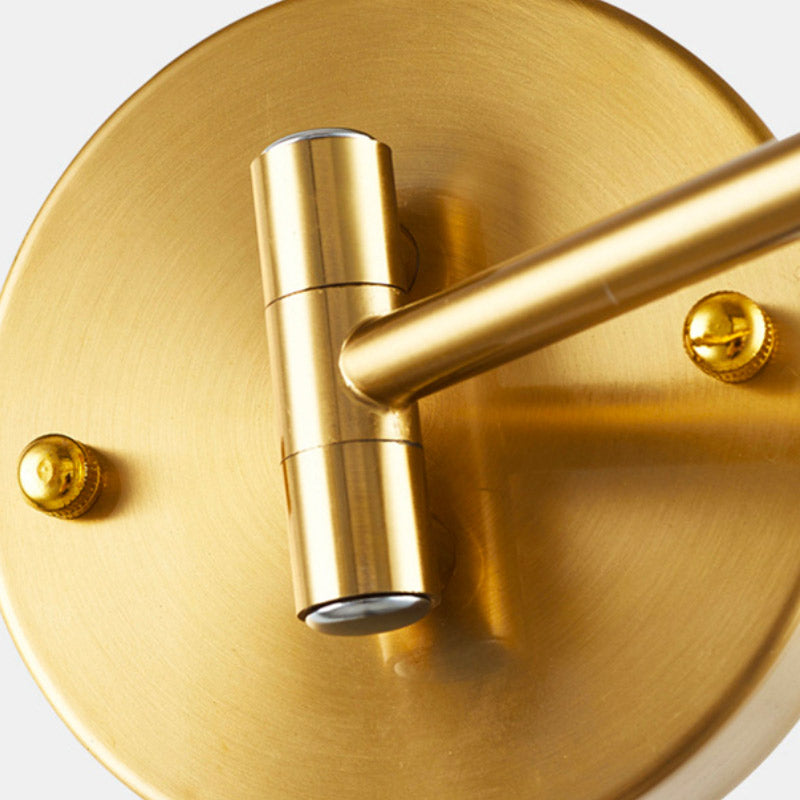 Gold wall light with smooth cylindrical arm, visible screws, E27 socket for versatile lighting.